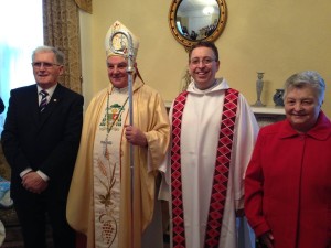 Bishop Seamus Freeman sac and Rev Rev Brendan McCarrick sac with his parents. 