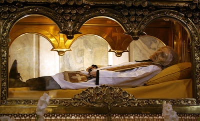 Actual picture of St. John Vianney incorrupt body, entombed at the main altar in the Basilica of InArs, France. His body has not yet decayed 150 years after his death