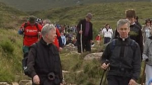 Archbishop Michael Neary with the papal nuncio, Archbishop Charles Brown, climbing the Reek. 