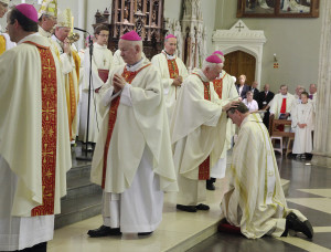 The laying on of hands: all the bishops present participate in this to signify Bishop Nulty's reception into the college of bishops. Photo: John McElroy.