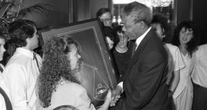 Cathryn O’Reilly, from Finglas, one of the Dunnes Stores strikers, with Nelson Mandela. Photograph: Frank Miller/Irish Tiimes 