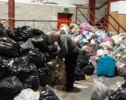 Clare Hallihan labels bags collected in Déise Philippines Appeal. 
