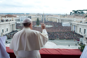 Pope Francis waves as he delivers his first "Urbi et Orbi"  message from the balcony overlooking St. Peter's Square at the Vatican