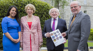 Misean Cara CEO Heydi Foster and Mrs. Sabina Higgins look on as Misean Cara Chairperson Matt Moran presents a copy of the 2014 Annual Report to President Michael D. Higgins. Photo: Keith Arkins.