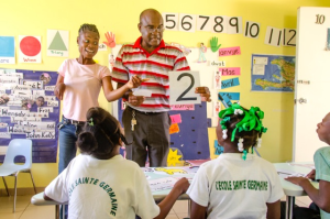 Teacher Frantz Desir and Assistant Darline Milord put on a lively display they teach Klas Ibiscus maths. Photo: NPH Haiti.