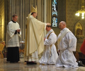 Archbishop Eamon Martin lays his hands on Fr Aidan McCann during his ordination.   Ordination to the Priesthood of Brian Slater and Aidan McCann   St Patrick's Cathedral Armagh   5 July 2015  Credit: LiamMcArdle.com