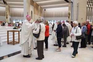 Bishop John McAreavey blessing a pilgrim on the first day of the National Eucharistic Congress in Knock. Pic John Mc Elroy. 