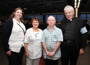 Nurses Jenny Navan, Bridget Mulligan, pilgrim David Morgan and pilgrimage director Fr Martin Noone at Dublin Airport on Monday morning waiting to board their flight to Lourdes. Pic John Mc Elroy. 