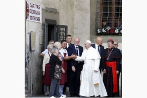 Pope Francis is greeted as he leaves Florence's Caritas charity organisation headquarters where he had lunch on Tuesday. Photo: Courtesy www.thestar.com 