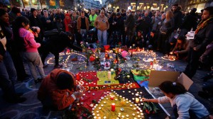 People gather around a memorial in Brussels following bomb attacks in Brussels. Pic courtesy: https://www.rt.com/
