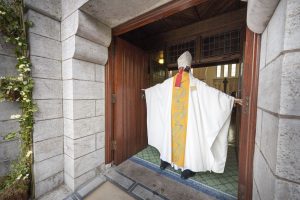 Archbishop Charles Brown crosses the threshold of the Door of Mercy on Lough Derg. Pic: Michael Mc Laughlin.