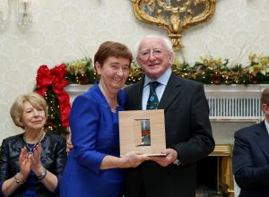 President Michael D. Higgins presenting Sr Mary Sweeney with her Presidential Distinguished Service award in the Peace, Reconciliation category at Áras an Uachtaráin. Pic: MaxwellPhotography.ie 
