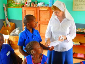 Sr Mary Sweeney with some children at St Joseph’s school. 